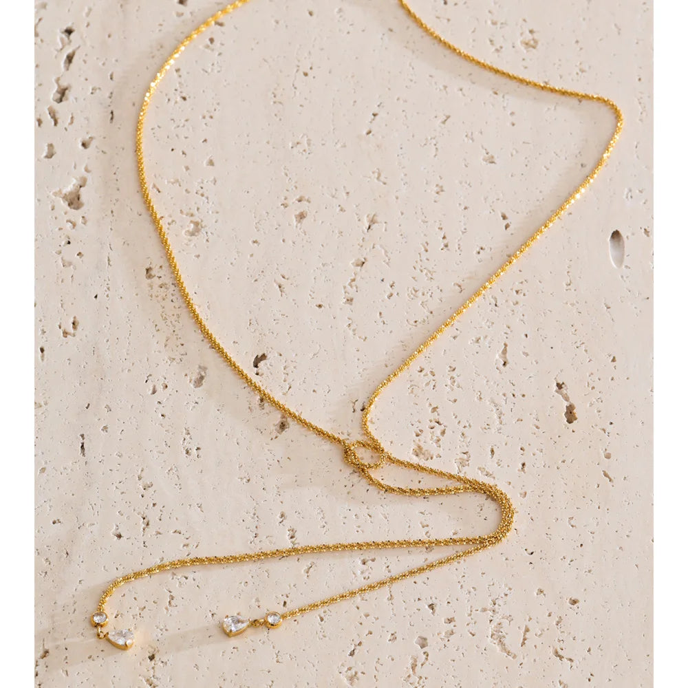 Cubic zirconia geometric chain necklace in gold-plated stainless steel with cubic zirconia.