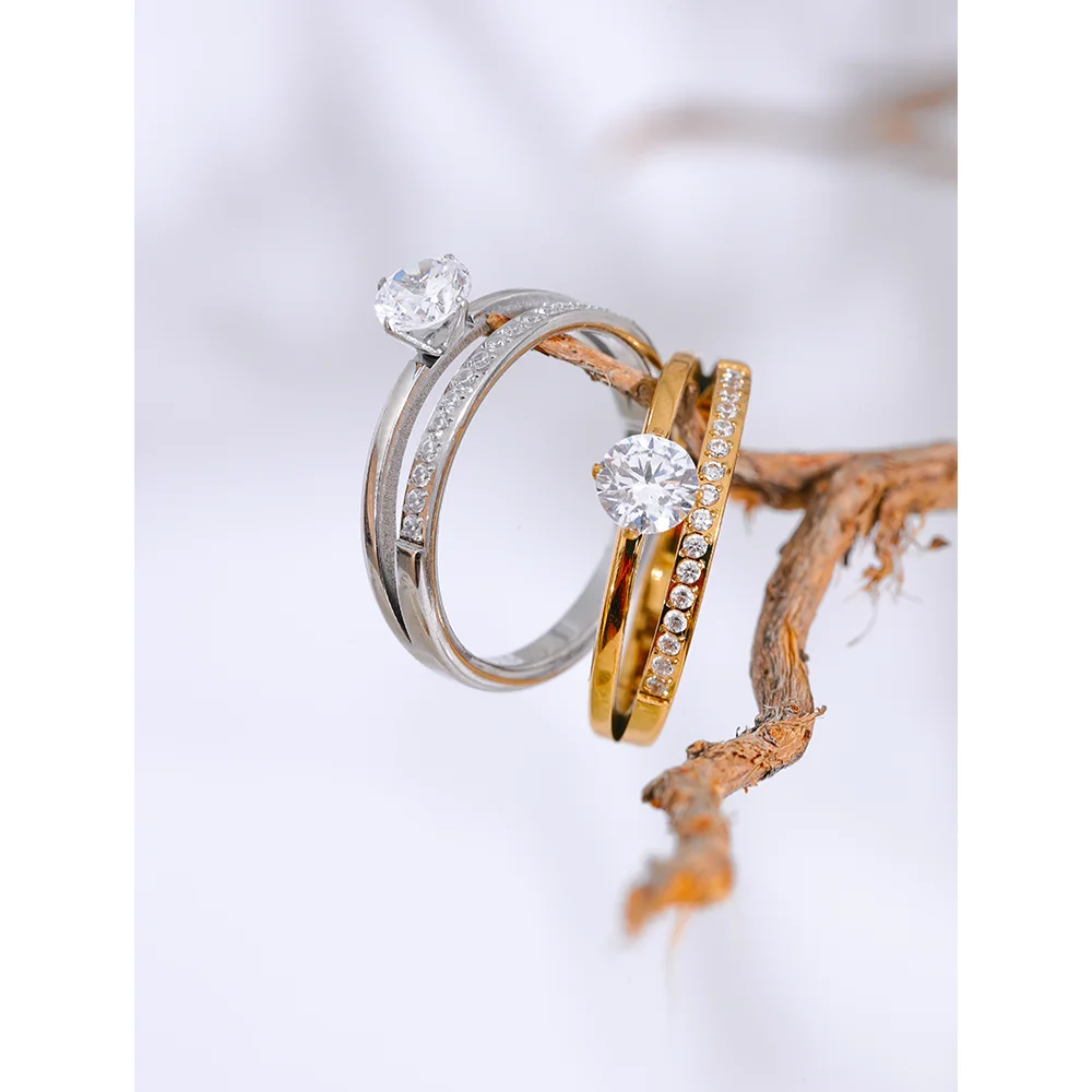 Cubic zirconia geometric layered ring in gold-plated stainless steel with cubic zirconia.