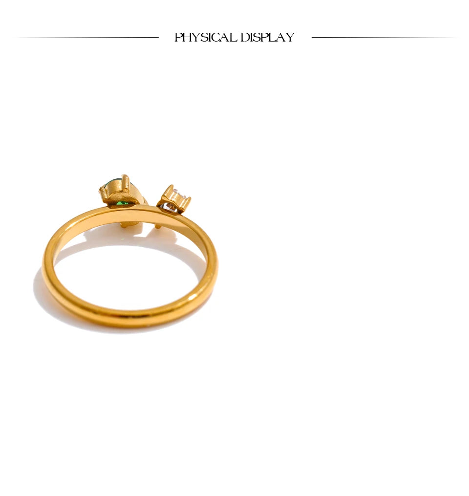 Cubic zirconia geometric ring in 18K gold-plated stainless steel with cubic zirconia.