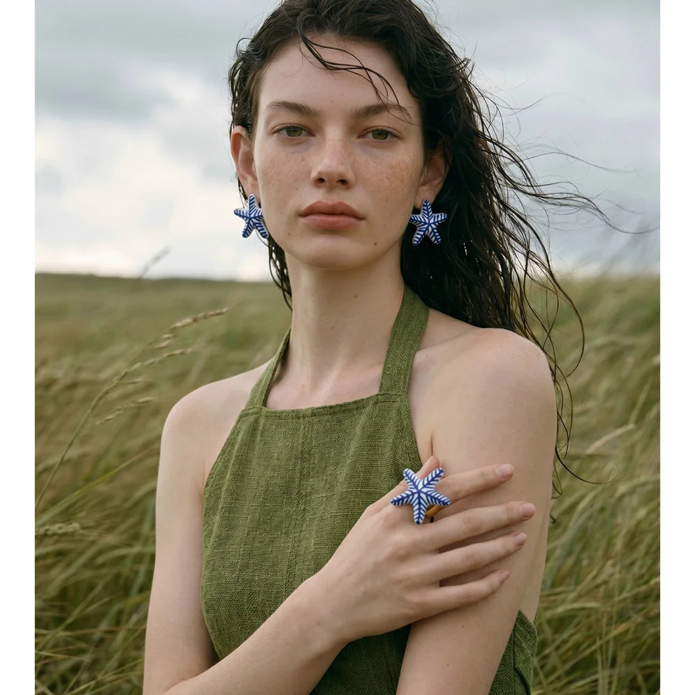 Blue star geometric earrings in gold-plated stainless steel.