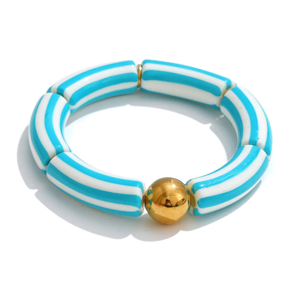 Resin acrylic multi-color bracelet in gold-plated stainless steel with resin and acrylic.