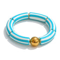 Resin acrylic multi-color bracelet in gold-plated stainless steel with resin and acrylic.