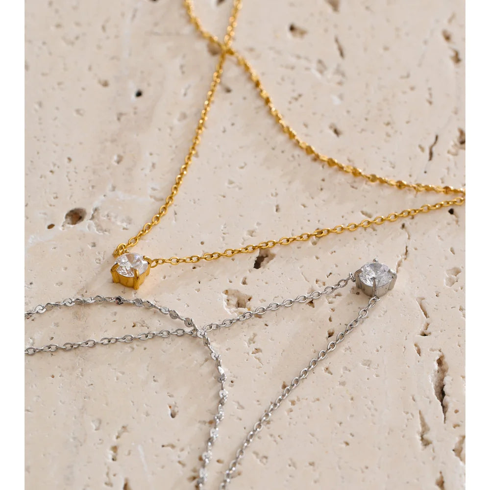 Cubic zirconia geometric chain necklace in gold-plated stainless steel with cubic zirconia.