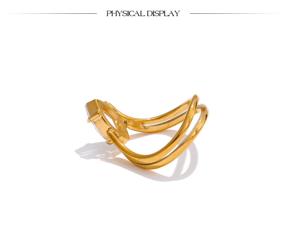Cubic zirconia geometric ring in 18K gold-plated stainless steel with cubic zirconia.