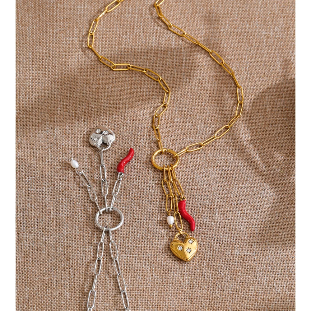 Cubic zirconia freshwater pearl heart necklace in gold-plated stainless steel with freshwater pearl and cubic zirconia.