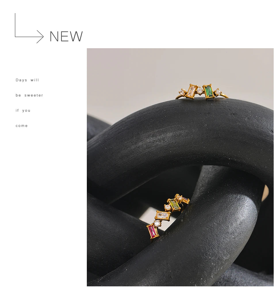 Cubic zirconia multi-color geometric ring in 18K gold-plated stainless steel with cubic zirconia.