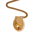 Gold-plated stainless steel necklace with a large oval pendant featuring a small hole in the center.