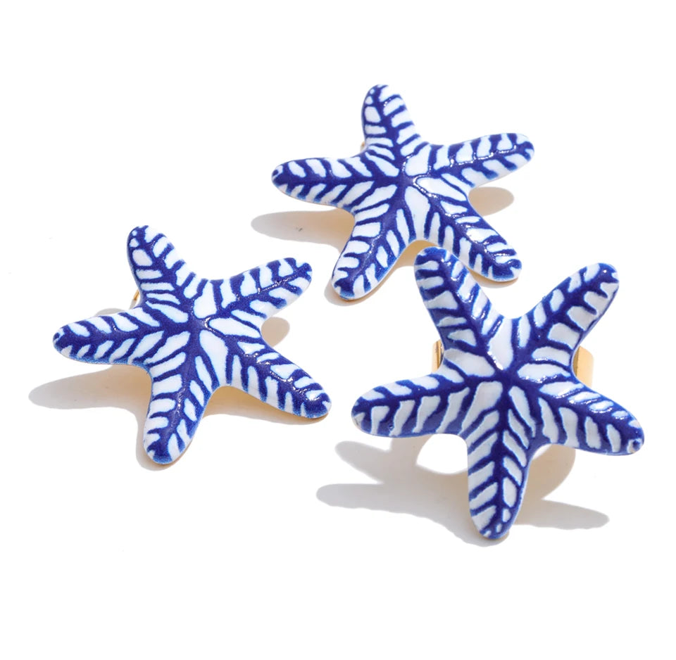 Blue star geometric earrings in gold-plated stainless steel.