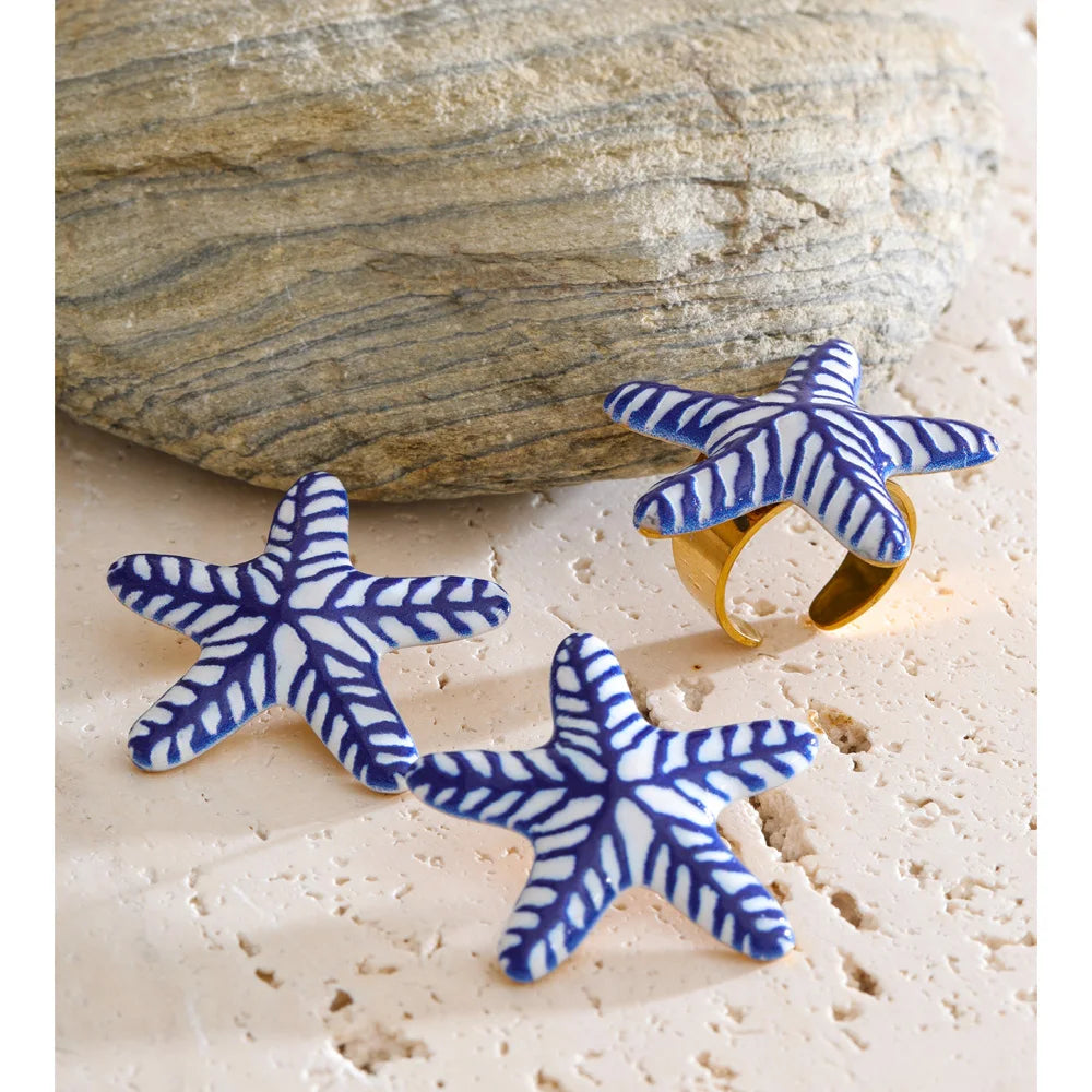 Blue star geometric earrings in gold-plated stainless steel.