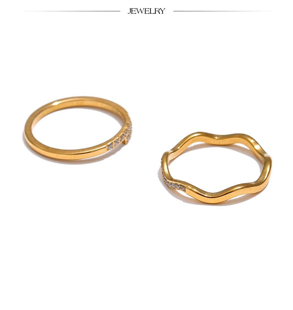 Cubic zirconia geometric ring in 18K gold-plated stainless steel with cubic zirconia.