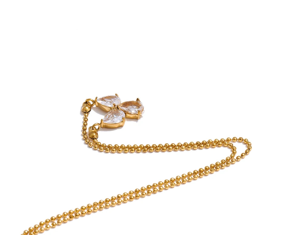 Cubic zirconia geometric necklace in gold-plated stainless steel with cubic zirconia.