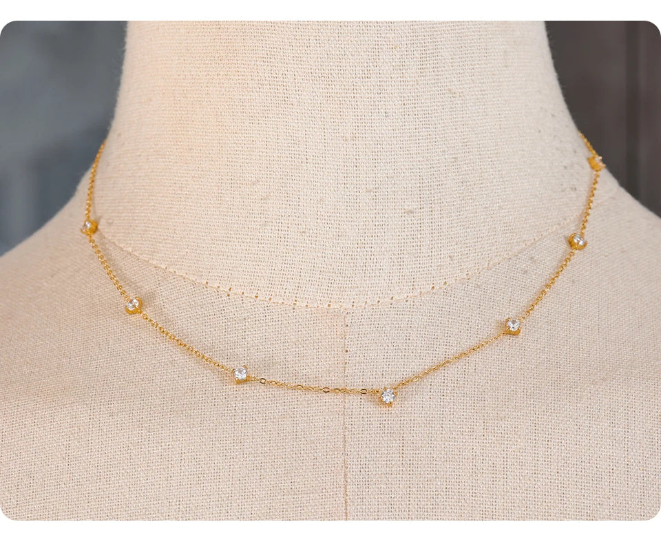 Cubic zirconia geometric necklace in gold-plated stainless steel with cubic zirconia.