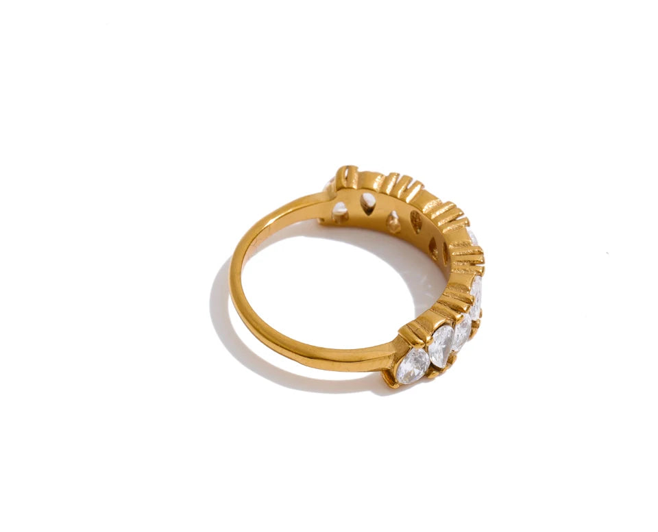 Cubic zirconia geometric ring in 18K gold-plated stainless steel with cubic zirconia.