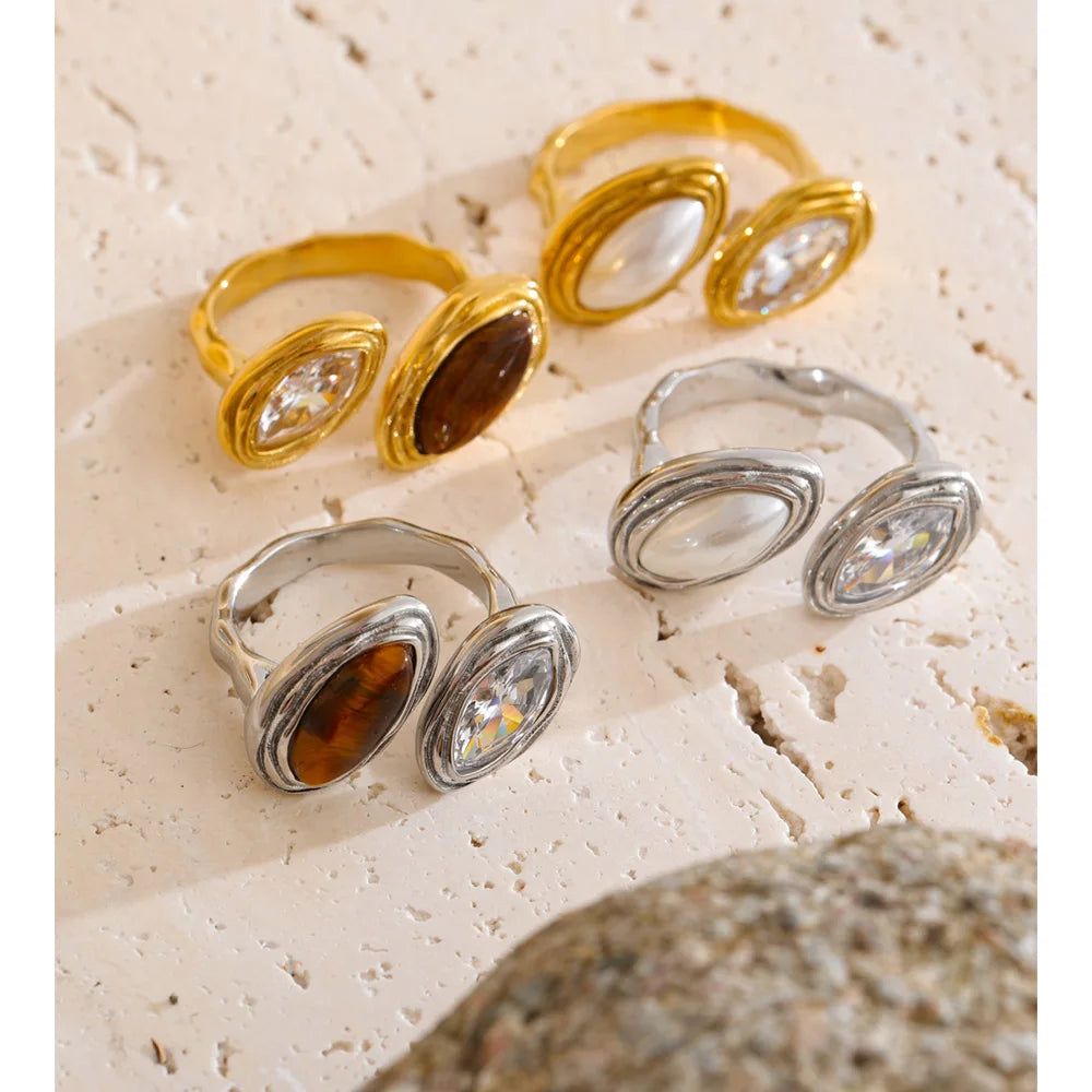 Cubic zirconia geometric ring in 18K gold-plated stainless steel with cubic zirconia.