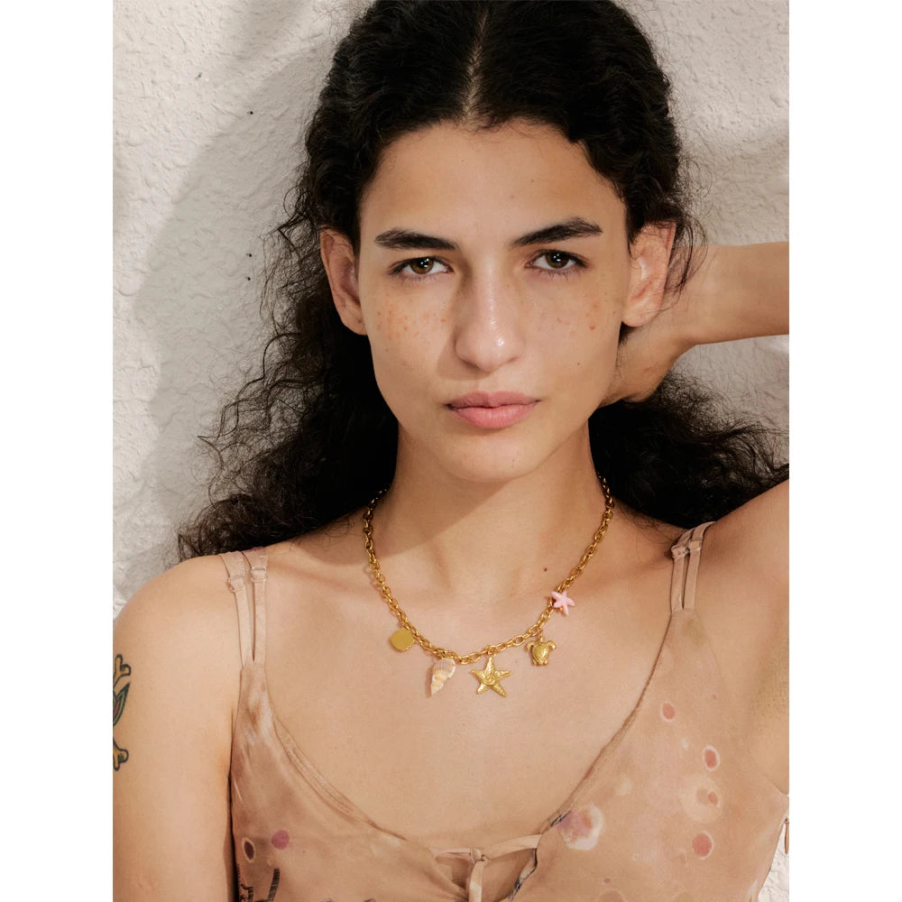 Sun geometric necklace in gold-plated stainless steel.