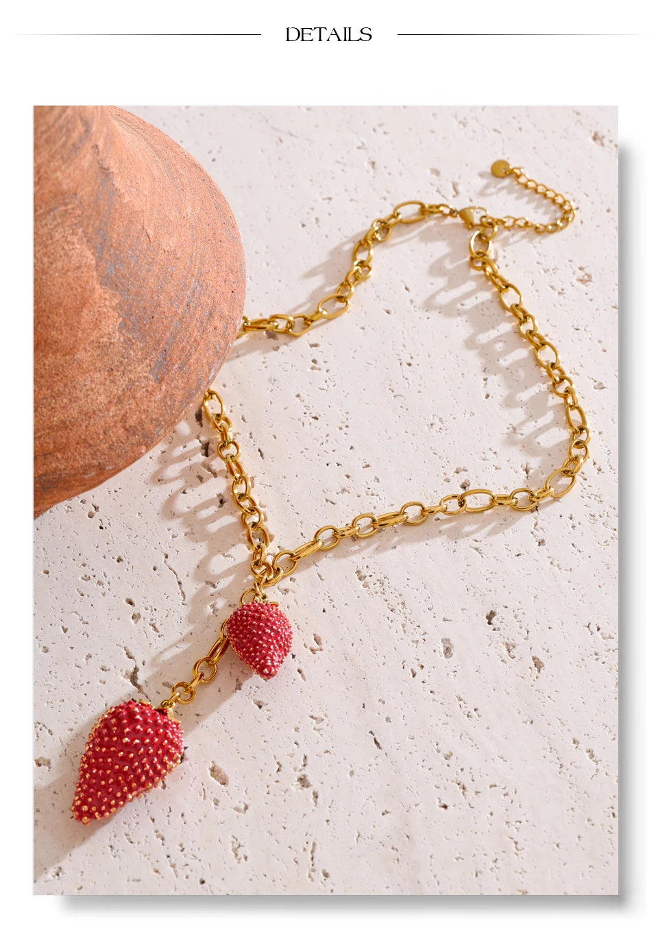 Red heart geometric necklace in gold-plated stainless steel.