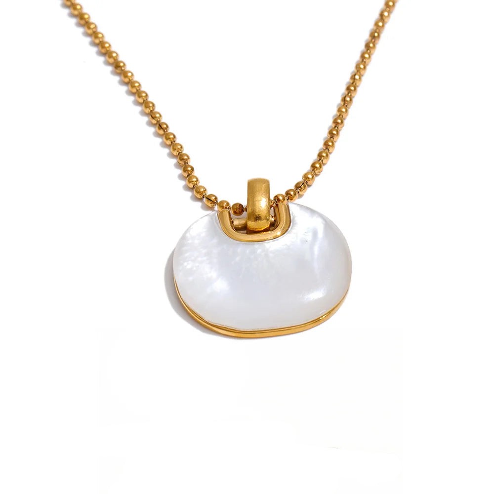 Gold-plated stainless steel necklace with a large white shell pendant.