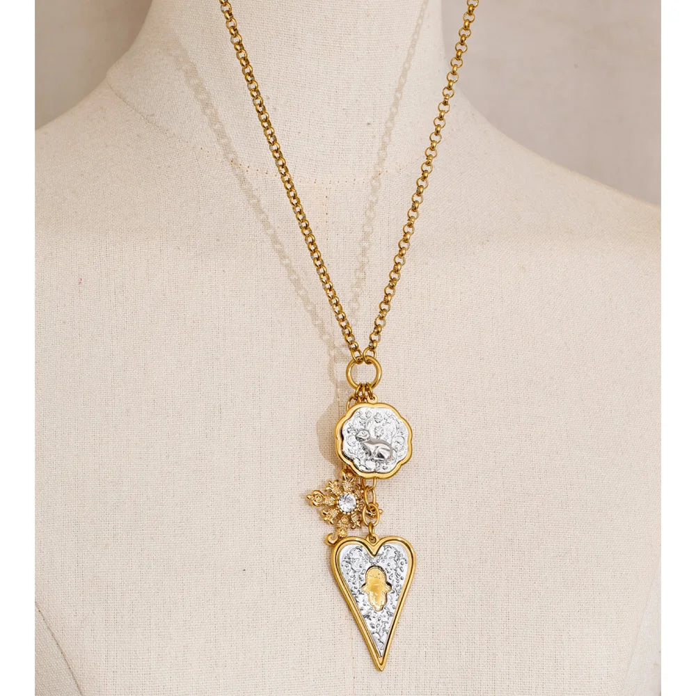 Heart cross necklace in gold-plated stainless steel.