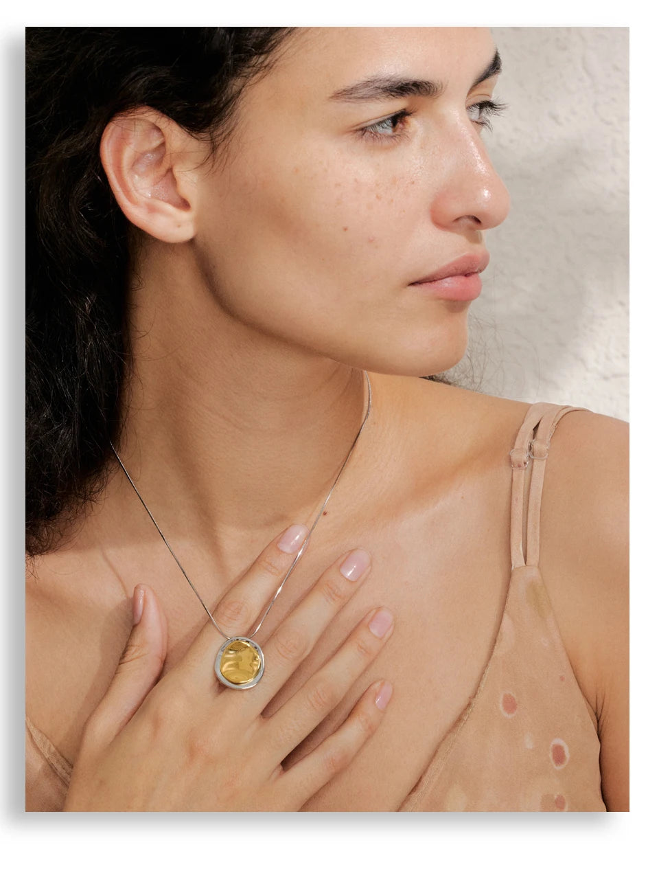 Coin geometric necklace in gold-plated stainless steel.