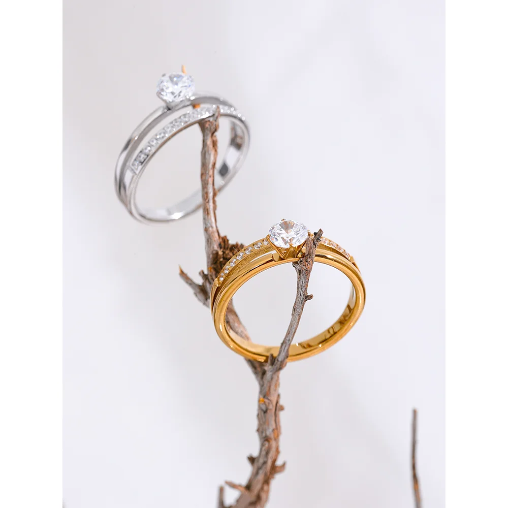 Cubic zirconia geometric layered ring in gold-plated stainless steel with cubic zirconia.