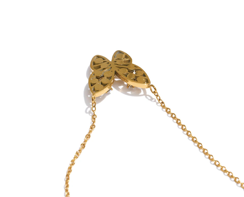 Cubic zirconia pearl butterfly necklace in gold-plated stainless steel with pearl and cubic zirconia.