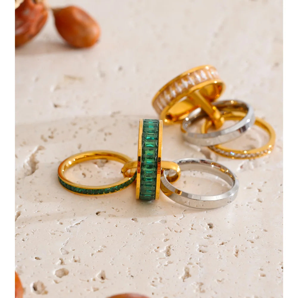 Cubic zirconia geometric layered ring in 18K gold-plated stainless steel with cubic zirconia.
