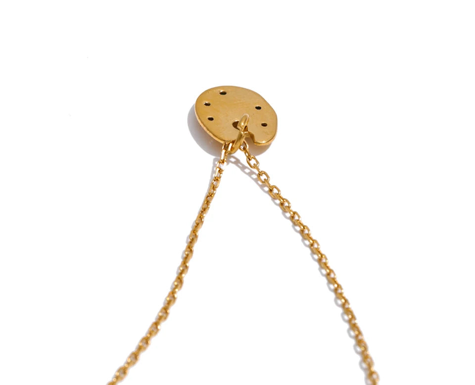 Cubic zirconia multi-color geometric necklace in gold-plated stainless steel with cubic zirconia.