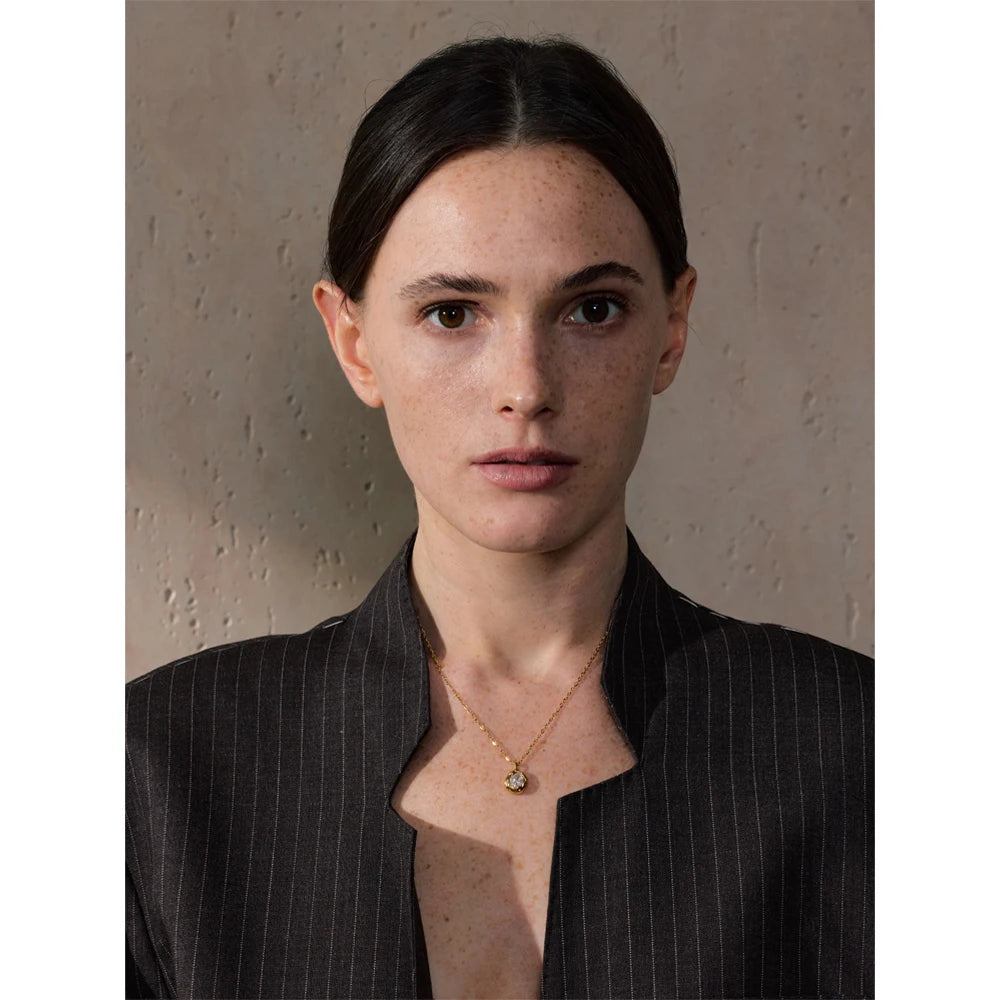Cubic zirconia geometric necklace in gold-plated stainless steel with cubic zirconia.