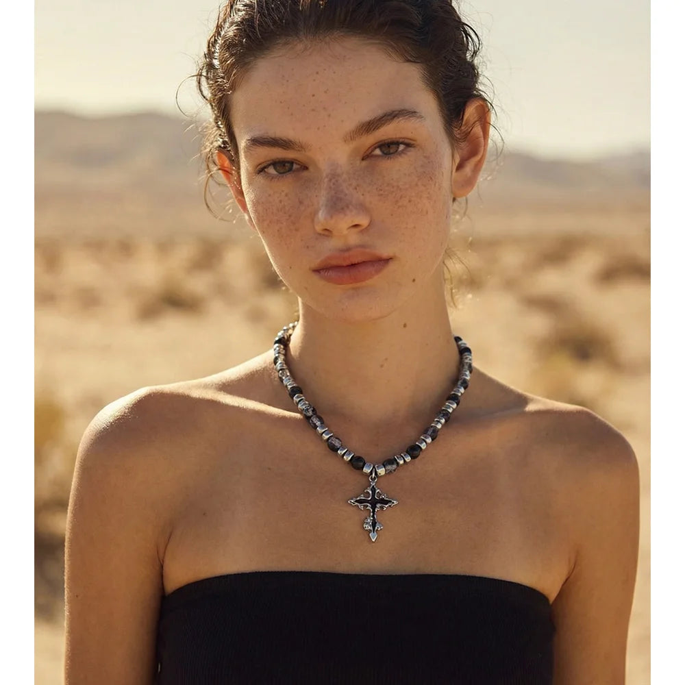 Natural stone cross beaded necklace in gold-plated stainless steel with natural stone.