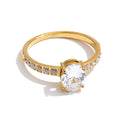 Cubic zirconia geometric ring in 18K gold-plated stainless steel with cubic zirconia.