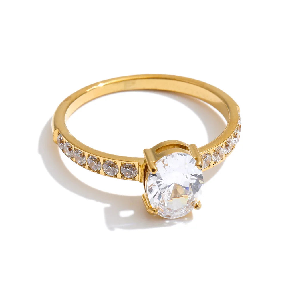 Cubic zirconia geometric ring in 18K gold-plated stainless steel with cubic zirconia.