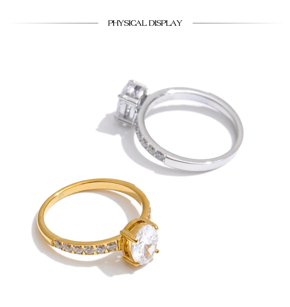 Cubic zirconia geometric ring in 18K gold-plated stainless steel with cubic zirconia.