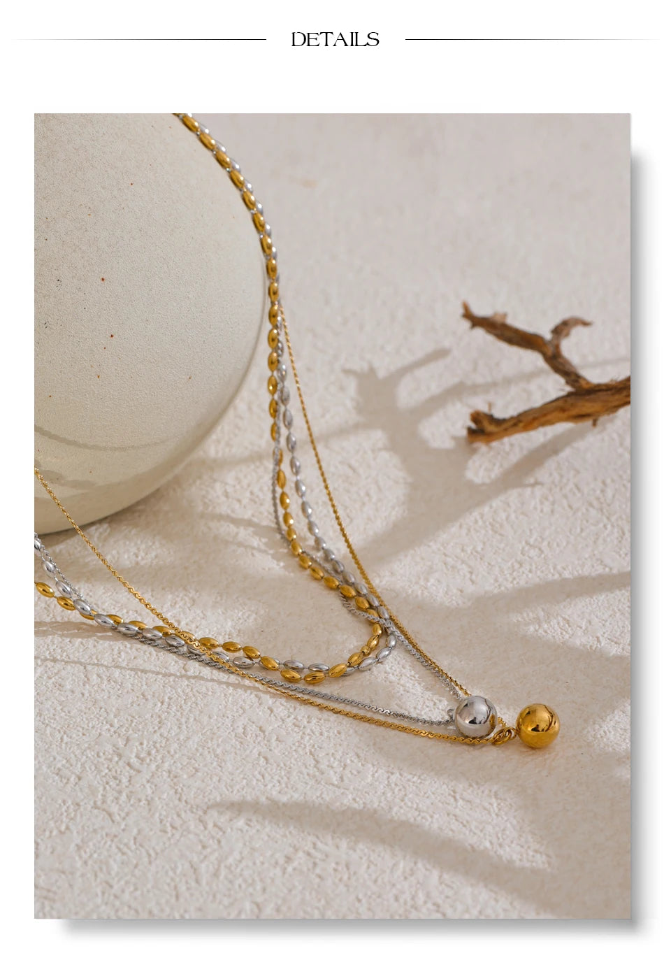 Geometric chain layered necklace in gold-plated stainless steel.