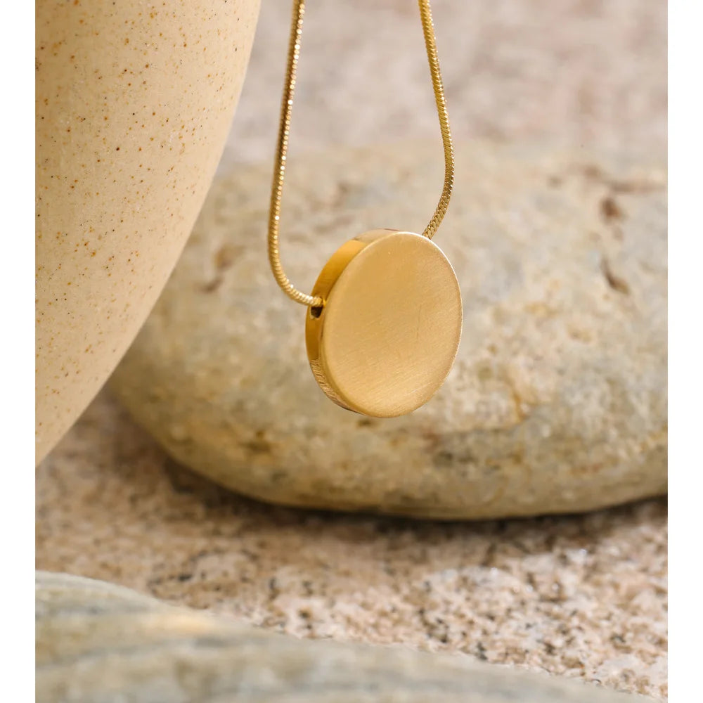 Coin geometric necklace in gold-plated stainless steel.