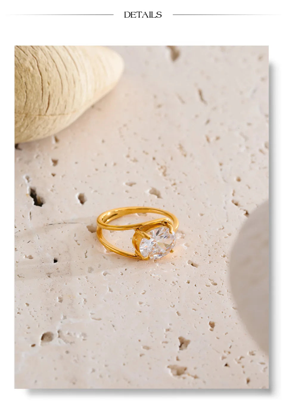 Cubic zirconia geometric ring in 18K gold-plated stainless steel with cubic zirconia.