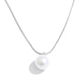 Pearl coin geometric necklace in gold-plated stainless steel with pearl.