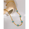 Gold-plated necklace with blue stones.