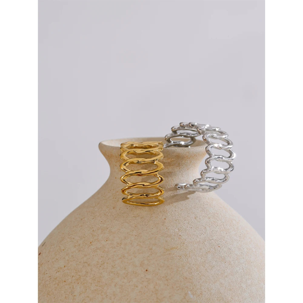 Geometric ring in gold-plated stainless steel.