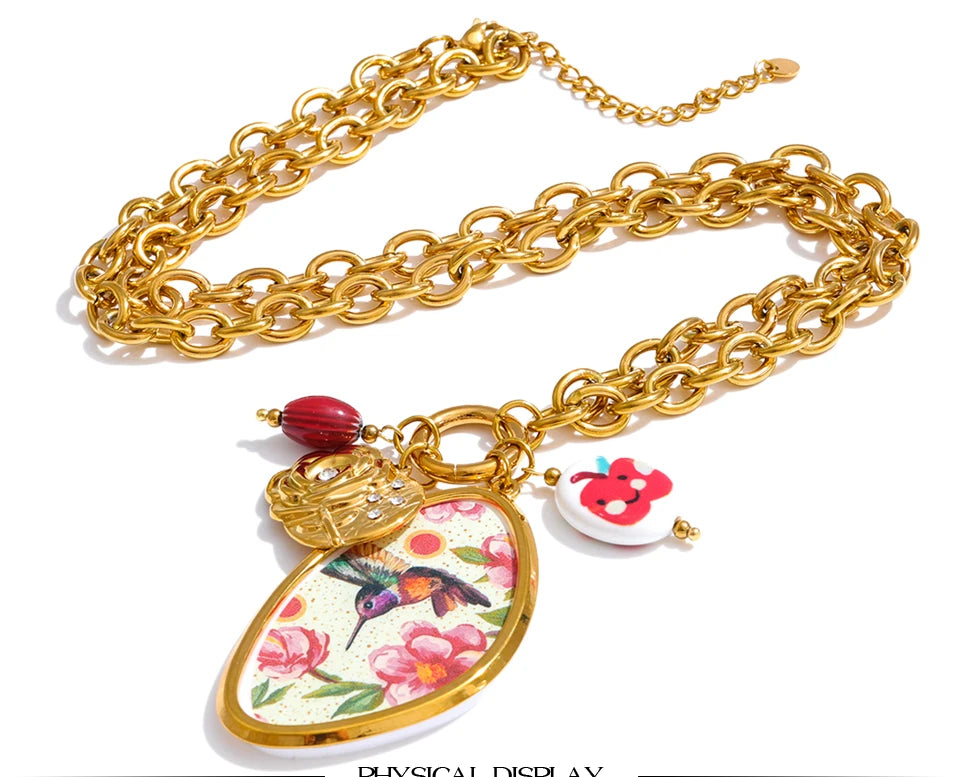 Cubic zirconia resin flower necklace in gold-plated stainless steel with cubic zirconia and resin.