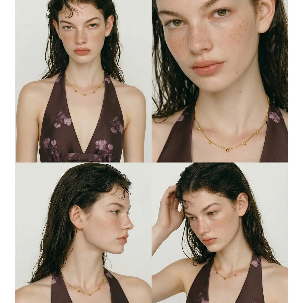 Beaded geometric chain necklace in gold-plated stainless steel.