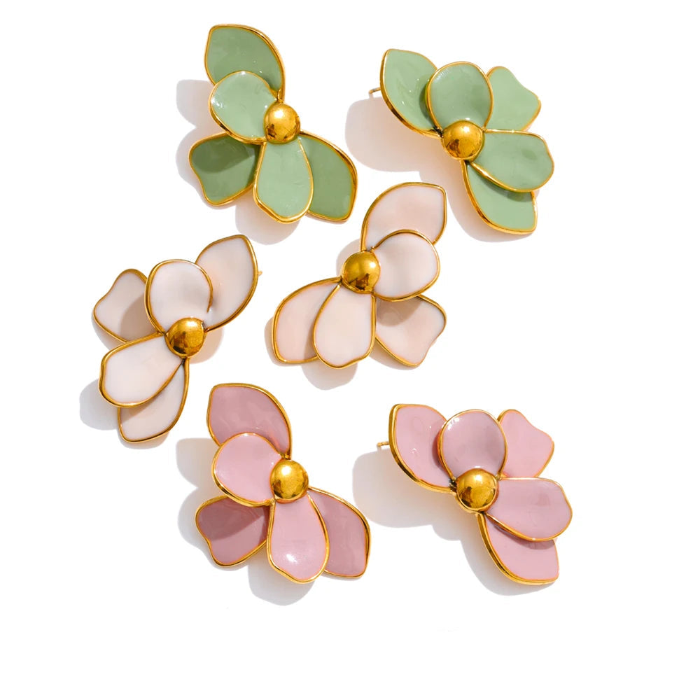 Gold-plated stainless steel earrings with enamel flowers in pink, green, blue, and white.