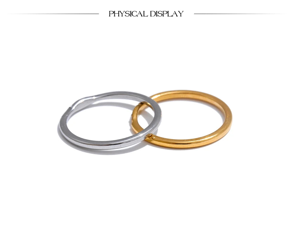Cubic zirconia geometric ring in 18K gold-plated stainless steel with cubic zirconia.