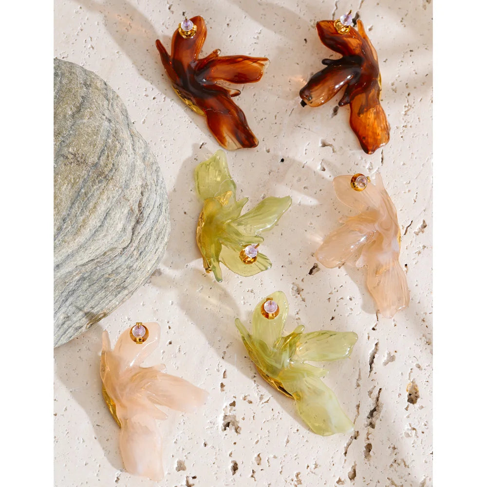 Green resin acrylic earrings in gold-plated stainless steel with resin and acrylic.