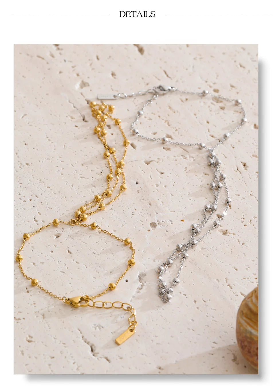 Beaded geometric chain necklace in gold-plated stainless steel.