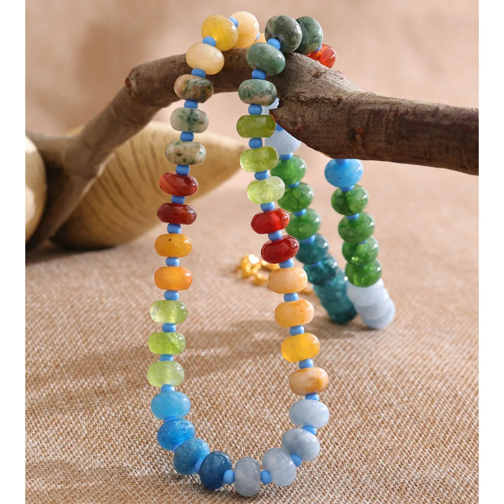 Natural stone beaded geometric necklace in gold-plated stainless steel with natural stone.