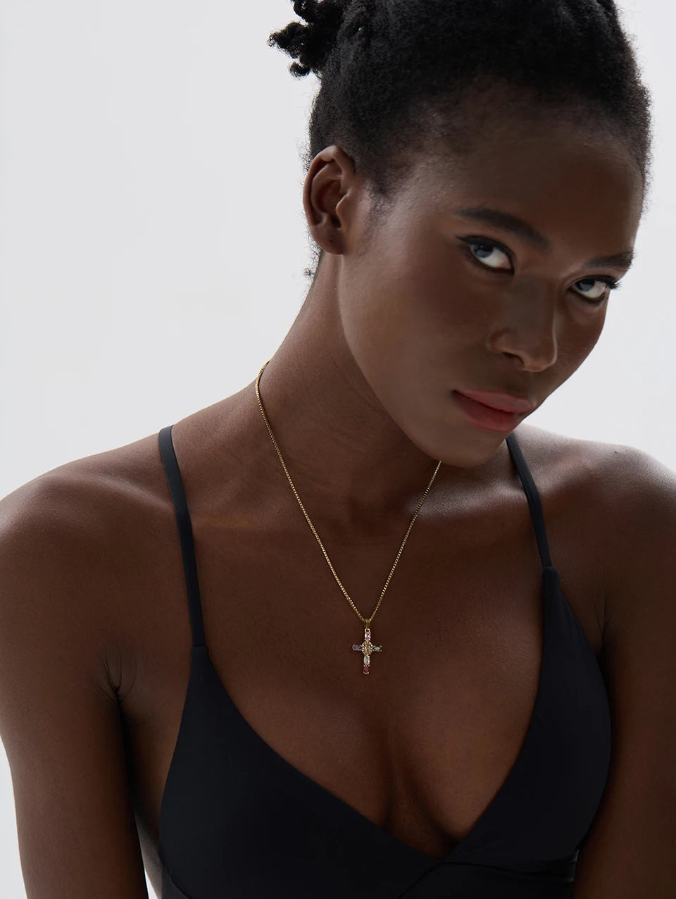 Cubic zirconia cross multi-color necklace in gold-plated stainless steel with cubic zirconia.