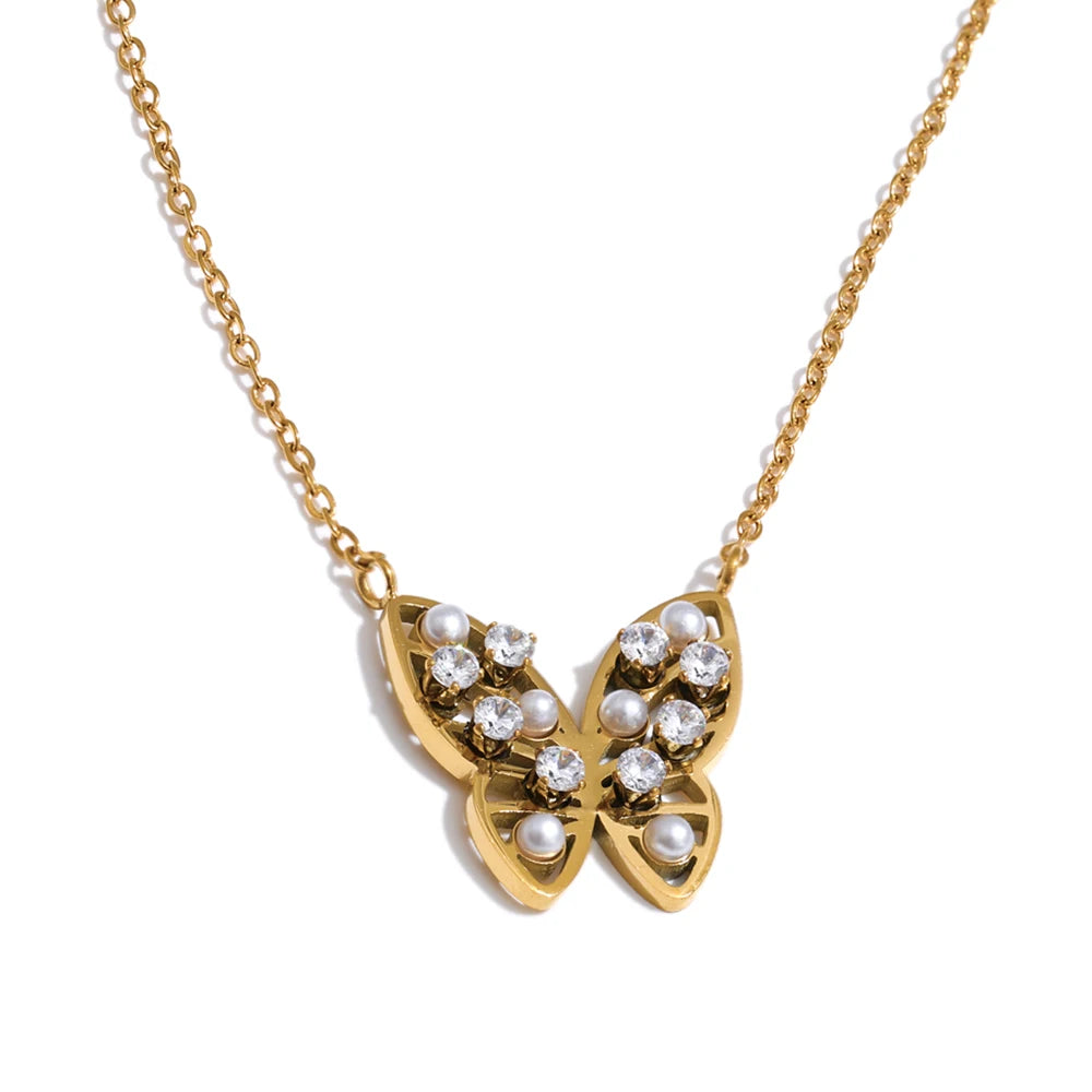 Cubic zirconia pearl butterfly necklace in gold-plated stainless steel with pearl and cubic zirconia.
