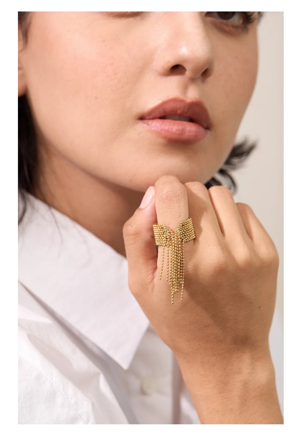 Geometric chain ring in 18K gold-plated stainless steel.