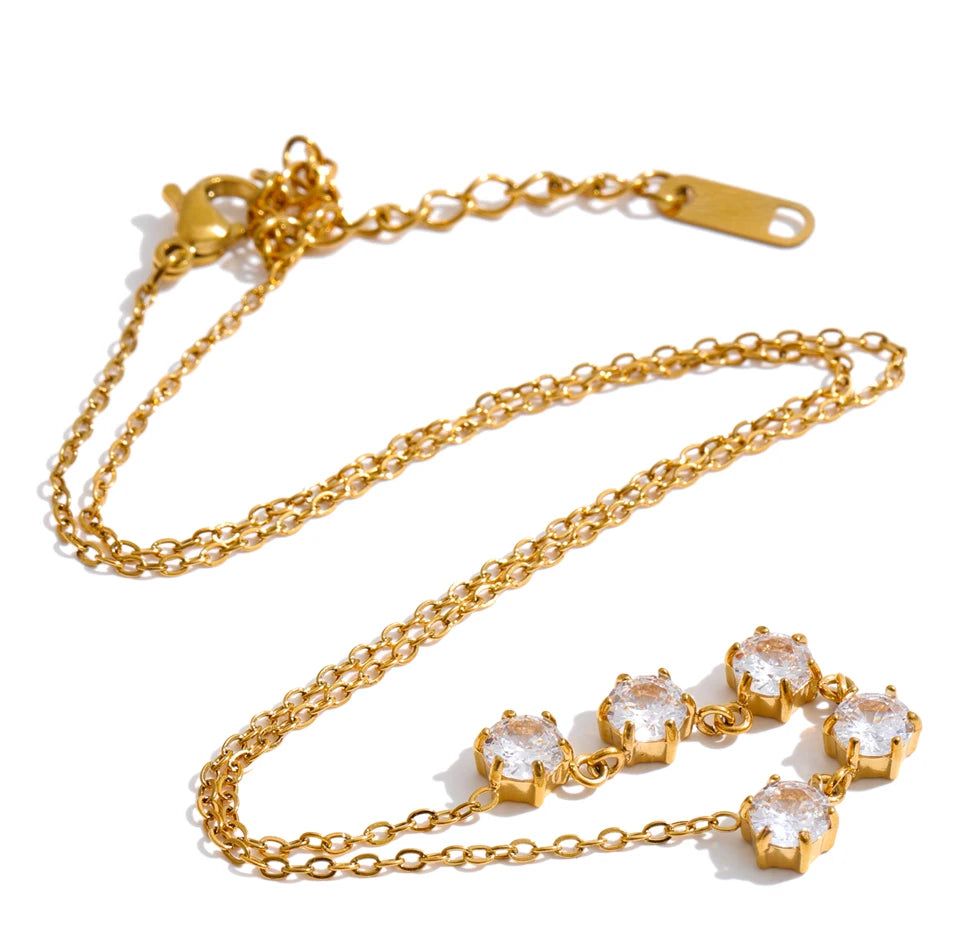 Cubic zirconia geometric necklace in gold-plated stainless steel with cubic zirconia.