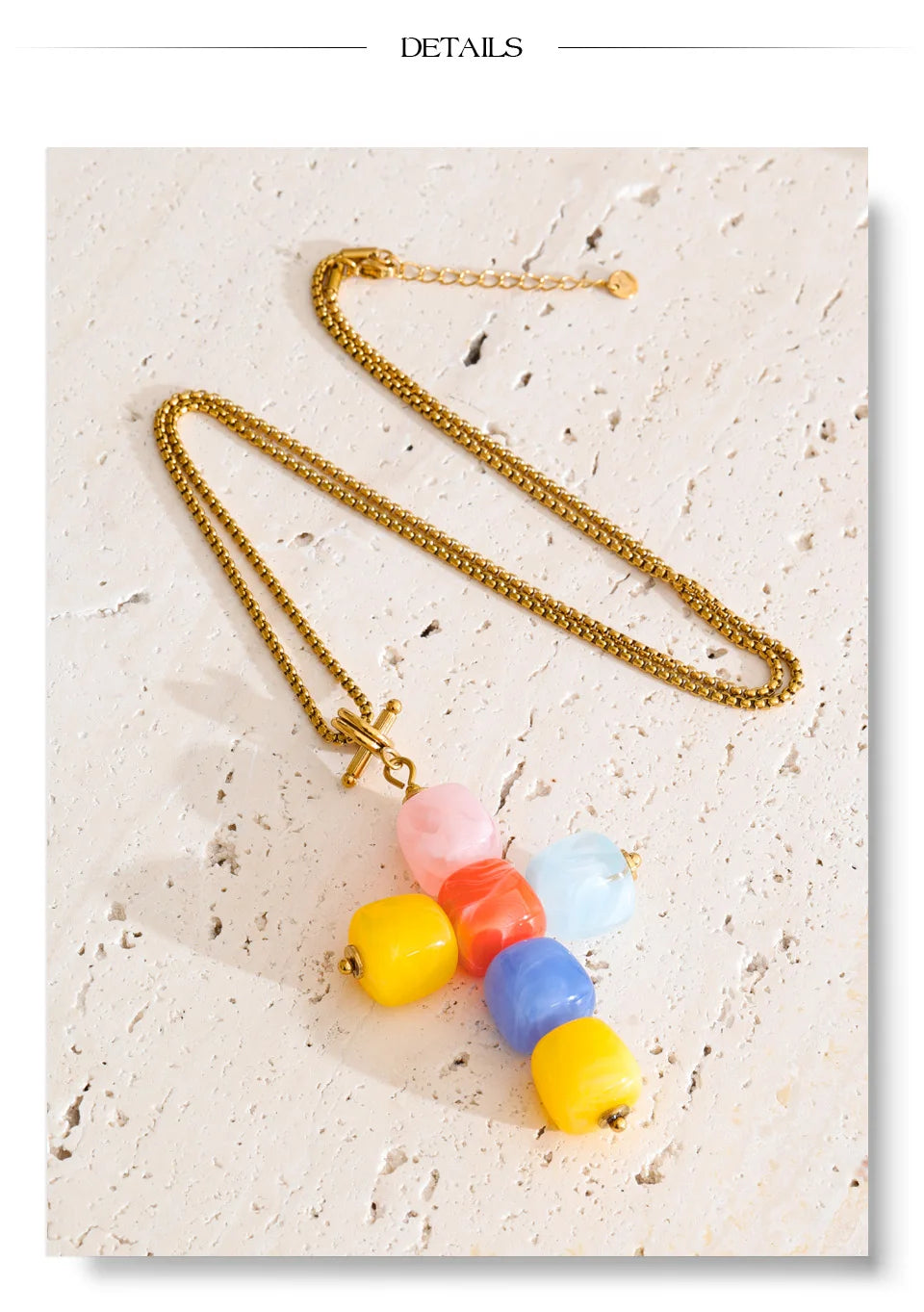 Resin acrylic cross necklace in gold-plated stainless steel with resin and acrylic.